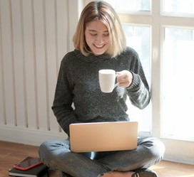 Telemedicine and BHC - Woman uses laptop while chatting with therapist